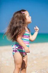 little girl have a good time at the beach