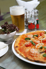 Seafood Pizza with salad and beer