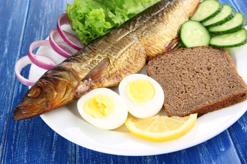 Smoked fish on plate close up