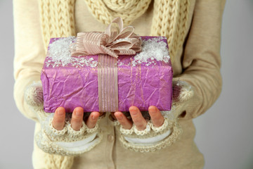 Female hands with gift box, close-up