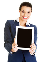 Business woman holding tablet PC with touch pad.