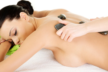 Beauty woman in spa. Stone massage.