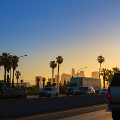 Naklejka premium LA Los Angeles sunset skyline with traffic California