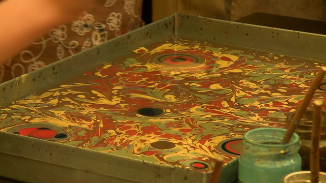 Learners of ebru art practicing