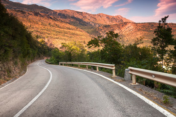 Curved  mountain highway in soft early morning sun light