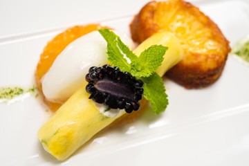 Piece of cake with fruits and ice-cream