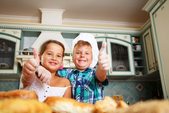 Happy children cooking homemade pastry