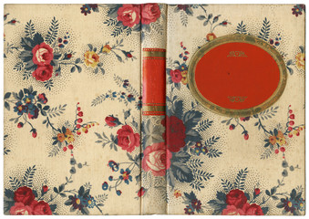 Old open book cover in canvas with floral roses drawing and rounded red and golden frame