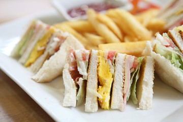 Club sandwich with on wood background