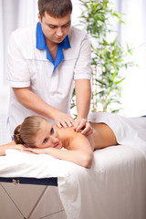 Fototapeta na wymiar Masseur is massaging female