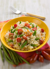 risotto with green beans and tomatoes, selective focus