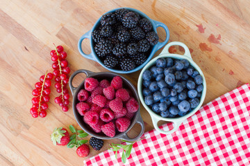 Three bowls of fresh raspberry