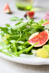 salad with cheese, rocket salad and grapes