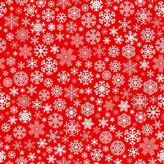 Christmas seamless pattern from snowflakes on red background