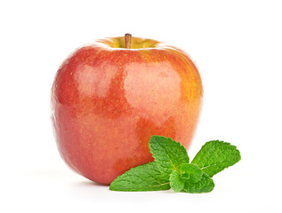 Red apple, cinnamon sticks and mint leaves