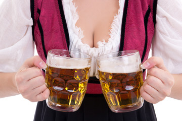 young sexy oktoberfest woman wearing a dirndl holding two beer m