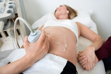 Obraz na płótnie Canvas Pregnant Woman Undergoing Ultrasound