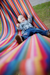 Lovely girl resting in a hammock