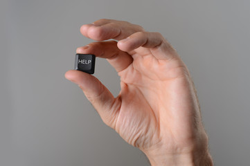 Fototapeta premium Help computer key in hand