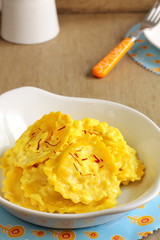 Ravioli with saffron cream sauce