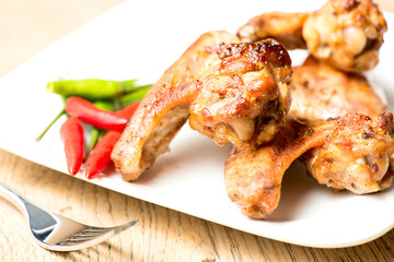 Hot chicken wings on plate