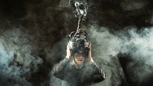 Business man wearing a brain-control helmet