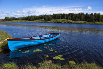 Blue boat in a lake, Connemara Ireland