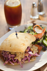 Pork cutlet sandwich with sauerkraut and mustard