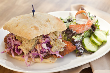 Pork cutlet sandwich with sauerkraut and mustard