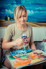 beautiful blonde woman painter