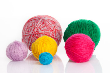 colorful different thread balls. wool knitting on white backgrou