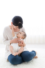 portrait of asian baby and mother relaxing