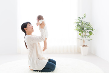 asian baby and mother relaxing