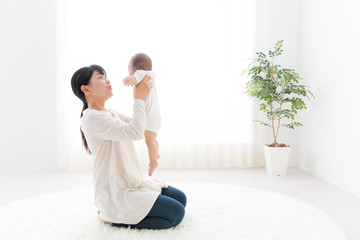 asian baby and mother relaxing