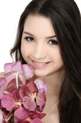 beauty woman with bouquet orchid flower in her hands