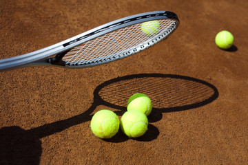 Tennis racket and balls, court