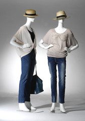 Full female clothing in jeans with bag on two mannequin