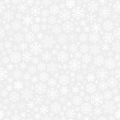 Christmas seamless pattern from snowflakes on gray background