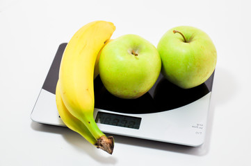 fruits on a kitchen scale