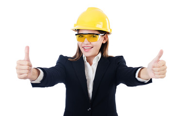 Young businesswoman with hard hat on white