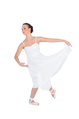 Focused young ballet dancer posing with her leg back © lightwavemedia