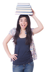 Young female student with books on white