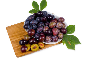 Platter of fresh ripe plums