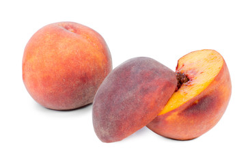 Succulent halved and whole fresh peach