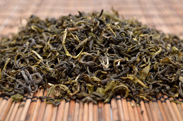 Dried green tea on the background