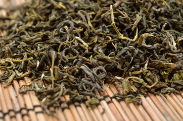 Dried green tea on the background