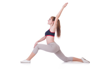 Fototapeta premium Young woman doing exercises on white