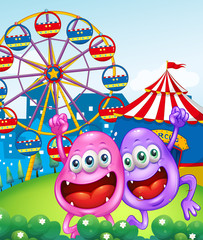Two happy monsters near the carnival