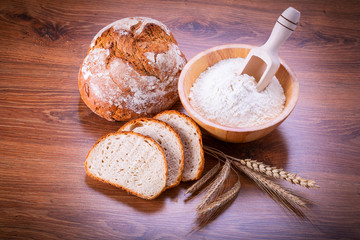 Freshly baked bread on wooden table