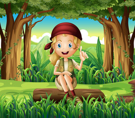 A forest with a young girl sitting above a log